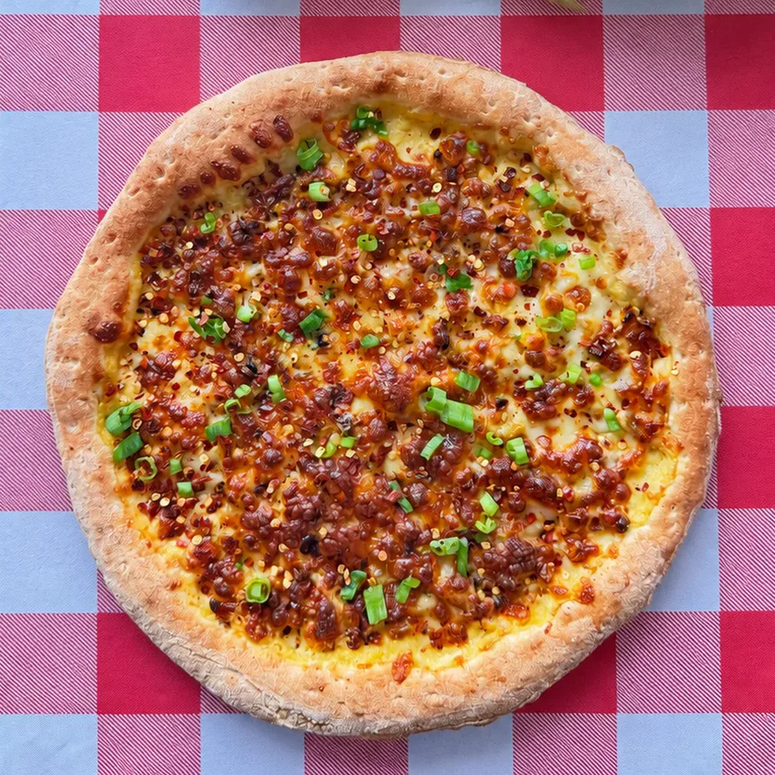 Big City Pizza's Cobfather pizza with roasted corn, chili flakes, and green onions.