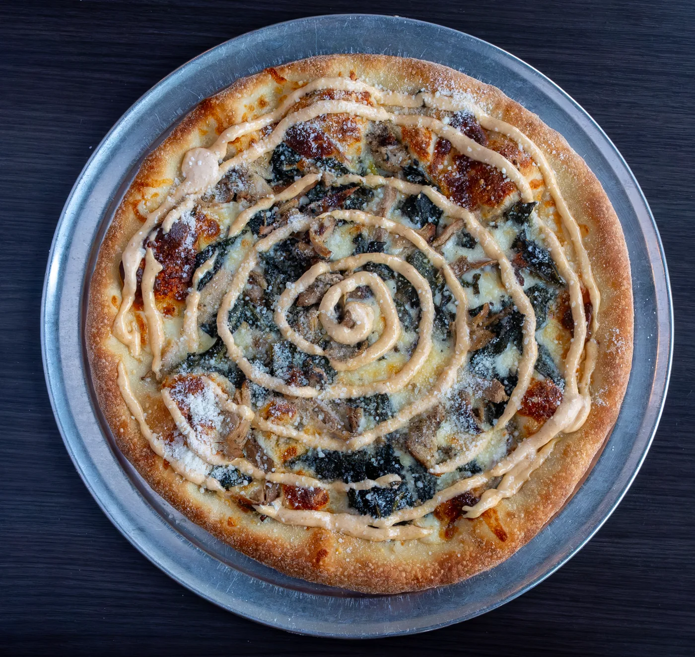 Ethereal Slice House's Fungi Fun Guy pizza with mushrooms, mozzarella, onion, and basil.
