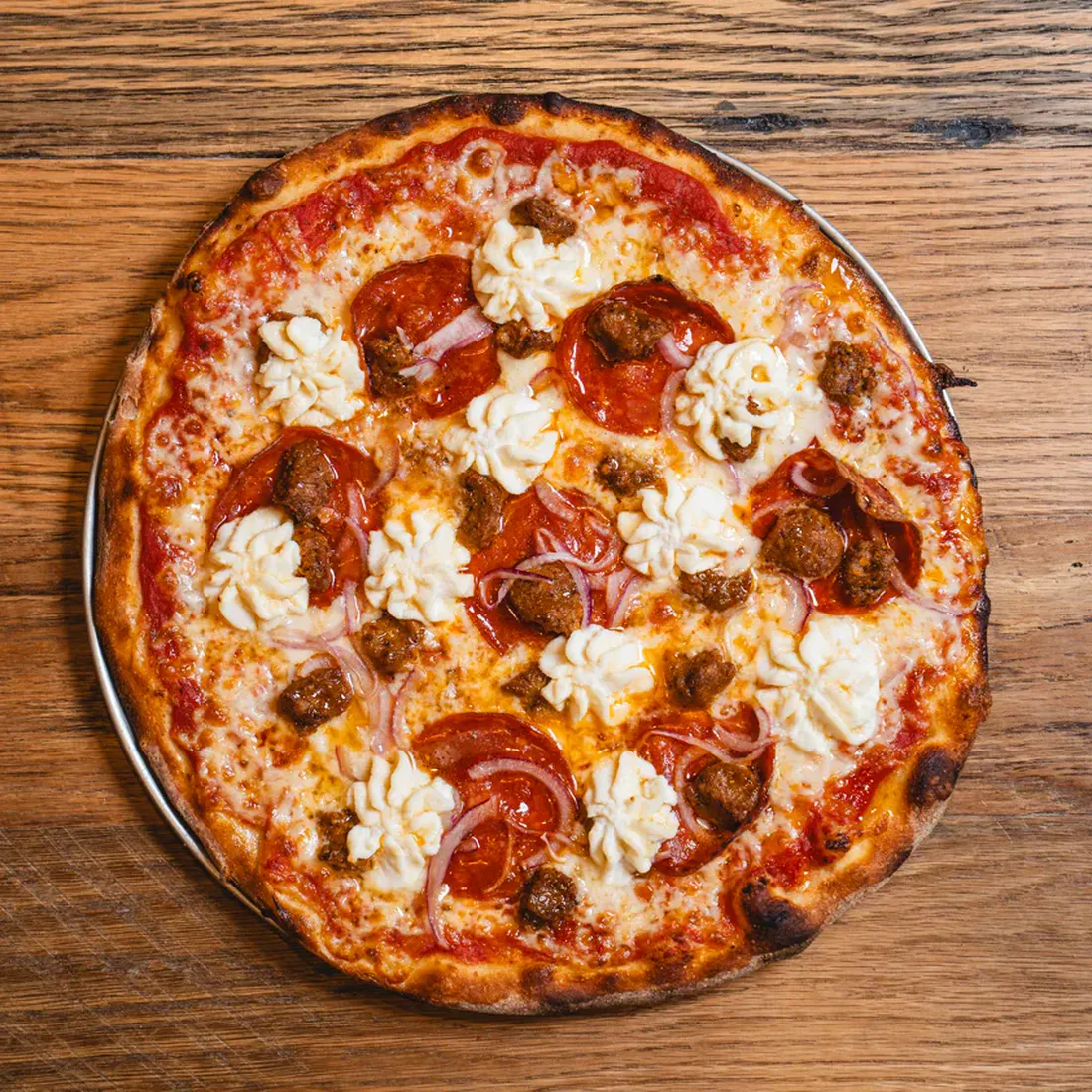 Goodfella's Spicy Sal pizza with pepperoni, spicy sausage, onions, and ricotta.