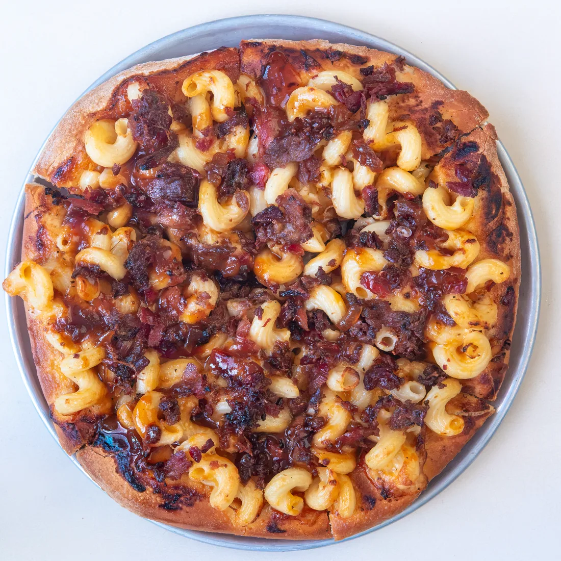 Joe Bologna's Wildcat Q pizza with smoked brisket, mac and cheese, and barbecue sauce.