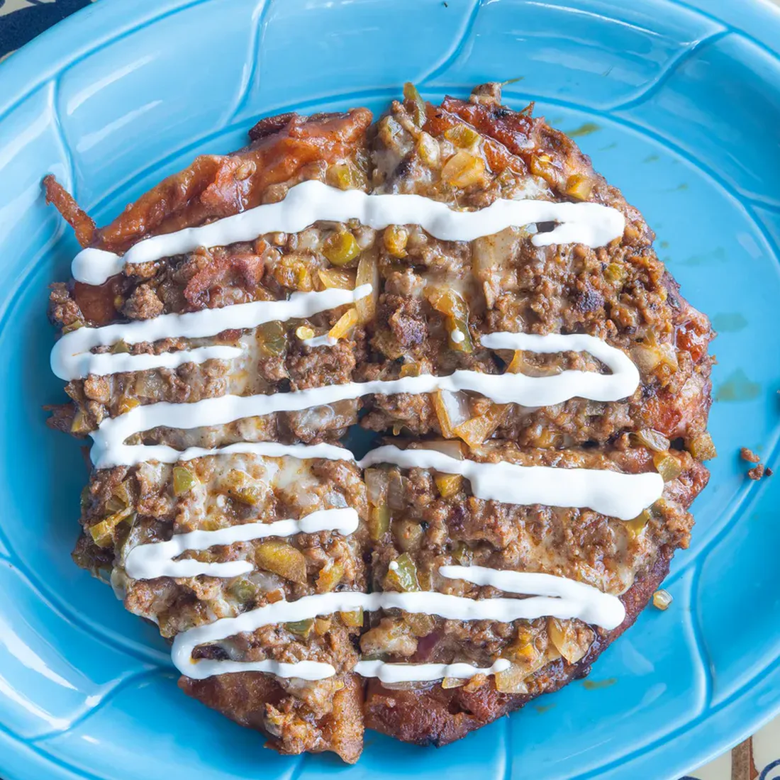 Mi Pequeña Hacienda's Mexican Pizza with chorizo, jalapeños, onions, and queso.