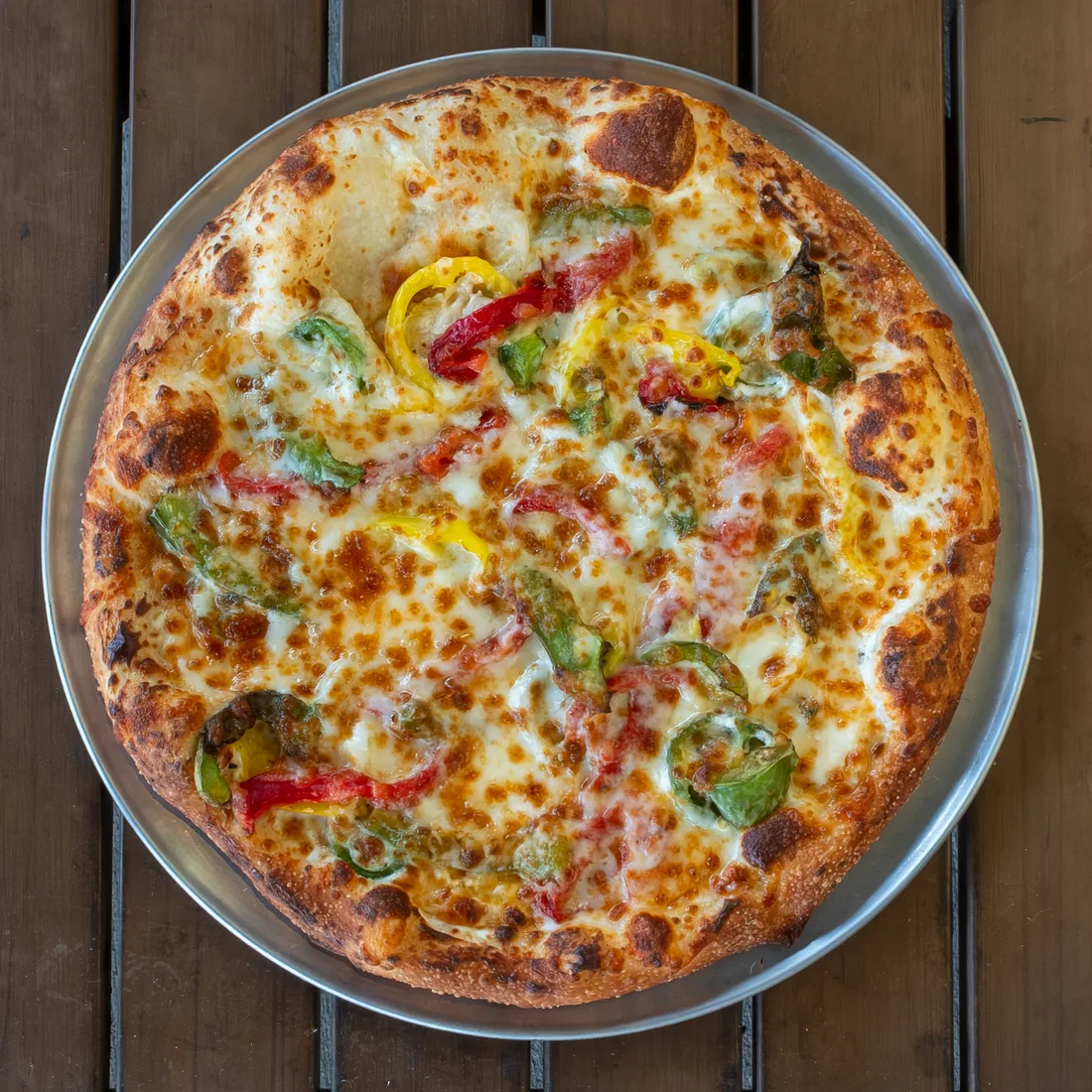 Pie Five's Needs More Pepper pizza with jalapeños, banana peppers, green peppers, and roasted red peppers.