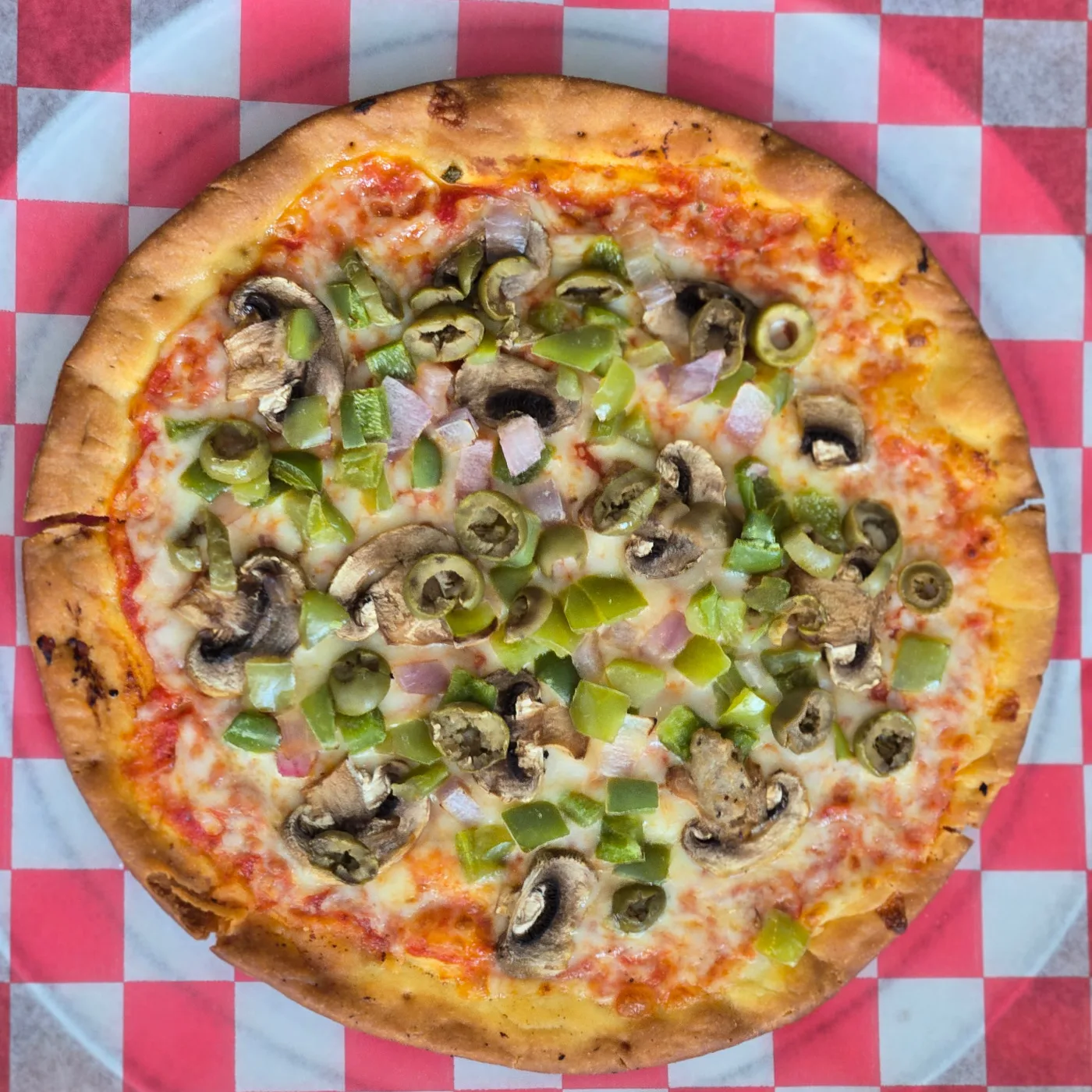 Southland Lanes' Maude's Artisan Veggie Delight pizza with olives, green peppers, onions, and mushrooms.